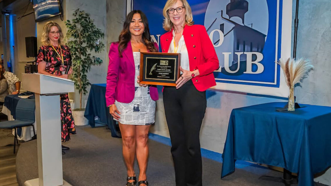 Julie Wright accepts the 2025 Andy Mace Award from the San Diego Press Club for for Outstanding Contribution in Public Relations