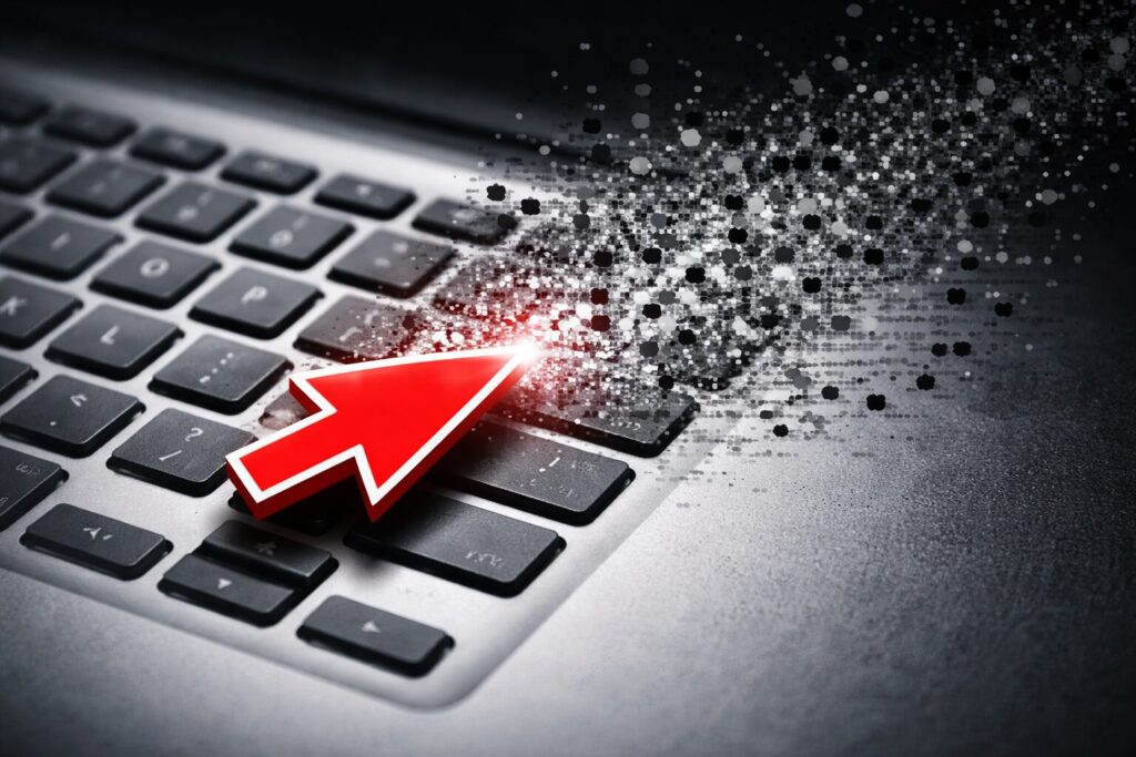 Cursor hovers over disintegrating keyboard - represents AI, journalism, newstinction
